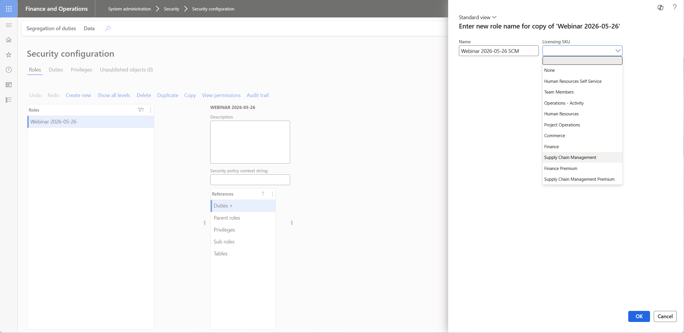 Security configuration Duplicate Role dialog, with a name field for the new role and a Licensing SKU dropdown showing options including Finance, Supply Chain Management, and Human Resources.